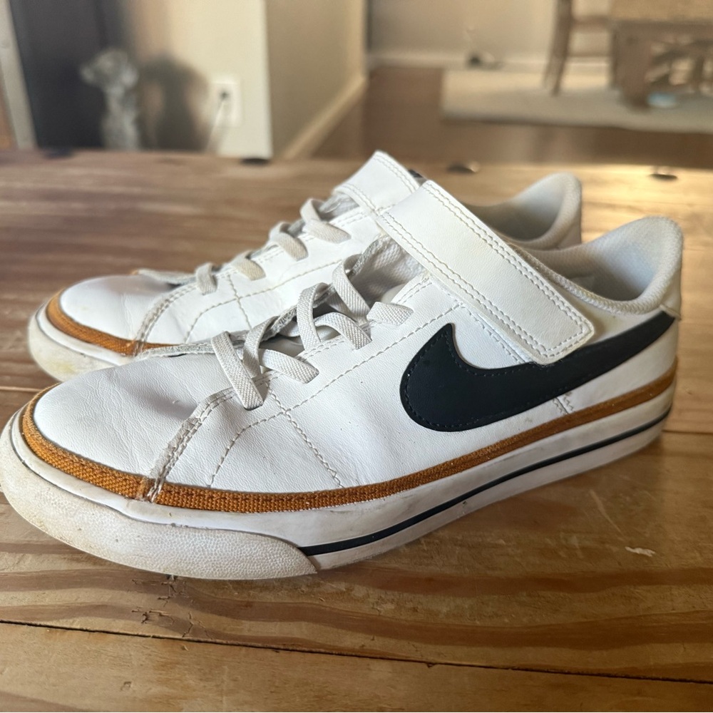 Nike Kids White and Black Sneakers with Gold Accents